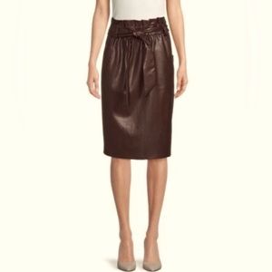 Removable belt, self tie skirt with elastic waist. Two front pockets. NWT